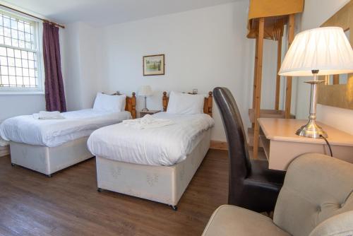 Postel nebo postele na pokoji v ubytování Millstone Country Inn