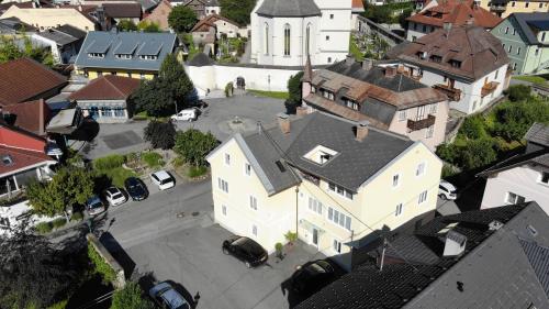 an aerial view of a town with a white building at Haus Pleterski in Obervellach