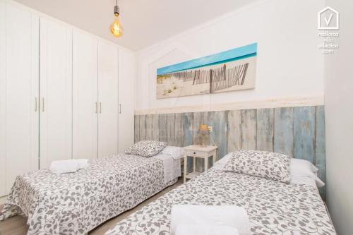 Giường trong phòng chung tại C350 Cantino by Mallorca Villa Selection