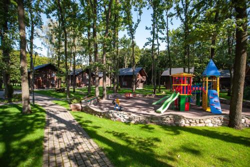 a park with a playground with slides and play equipment at Turiyske Podvir'ya in Blazhennik