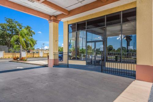 a view of a building with glass windows at Rodeway Inn Port Richey North in Port Richey