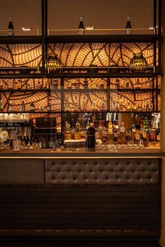 a restaurant with a counter with a counter at Chester Hotel Heidelberg in Heidelberg