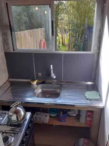 a kitchen with a sink and a window at Pez Espada in Punta del Este