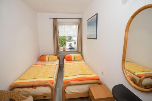 Postel nebo postele na pokoji v ubytování Ferienwohnung Krabbenkutter