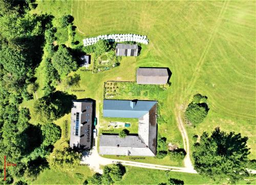an aerial view of a building in a field at Höblinghof in Schwarzau im Gebirge