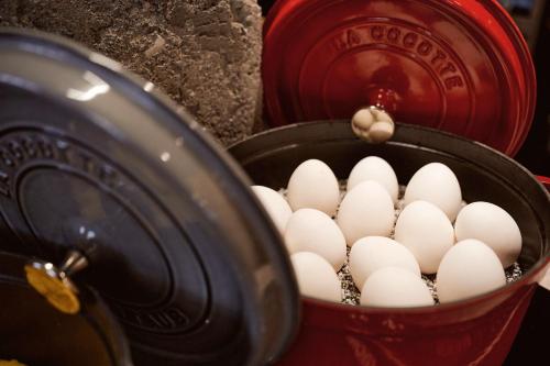 a bunch of eggs in a bucket next to a fire hydrant at Hotel Europe in Zurich