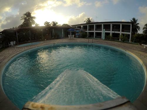 a large pool of water in front of a building at Hotel de Trânsito da PM-PE in Olinda