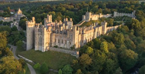 an old castle in the middle of a forest at Stunning Georgian Flat in The Heart of Midhurst Old Town in Midhurst