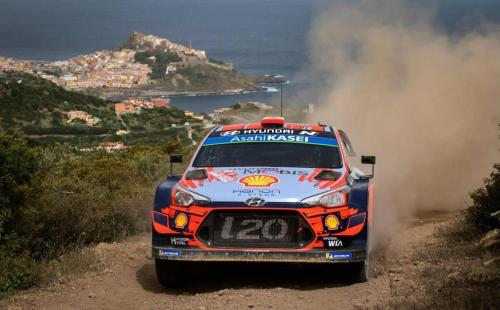 a rally car is driving down a dirt road at JANAS Country House in Castelsardo