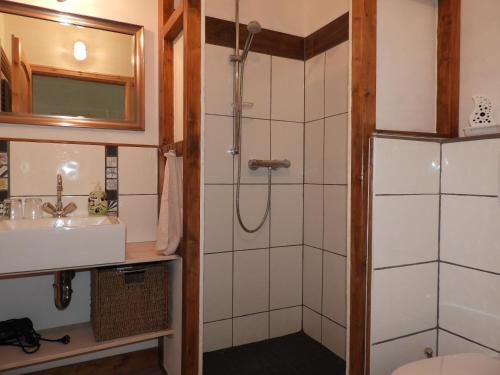 a bathroom with a shower and a sink at Ferienwohnung Rossenhof in Weesby