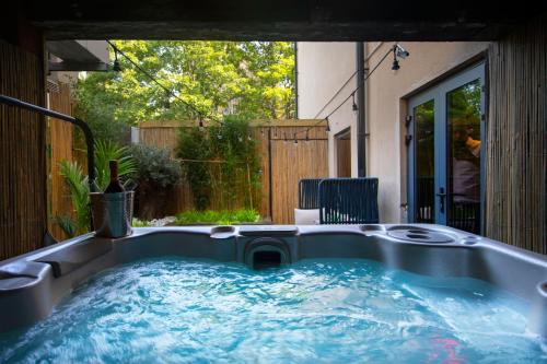 a jacuzzi tub in the backyard of a house at The Bells - Luxury Serviced Apartments in Leeds