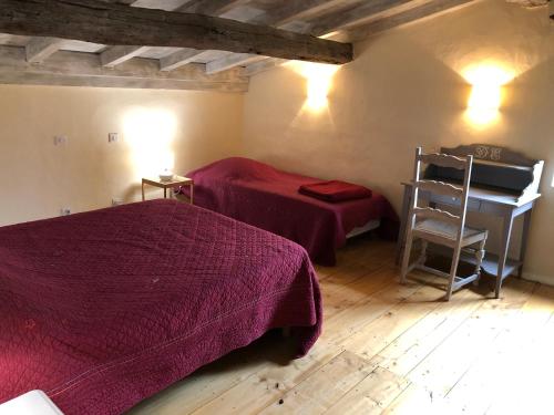 Postelja oz. postelje v sobi nastanitve Domaine d'Esquirol