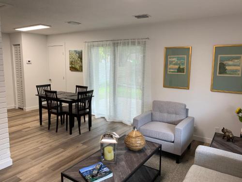 a living room with a couch and a table at Harbourside Flats in Fort Lauderdale