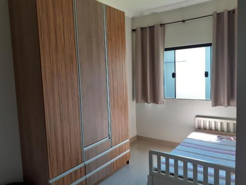 Ένα ή περισσότερα κρεβάτια σε δωμάτιο στο Ibiza Inn Suítes Uberaba