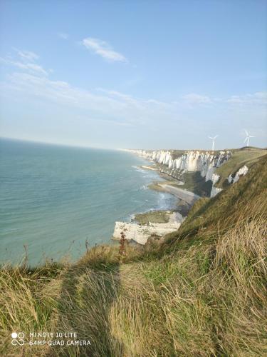 a view of the ocean and white cliffs at LE WELCOME vue port appartement plain pied in Fécamp