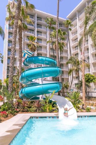 a slide in a pool at a resort at Town and Country San Diego in San Diego