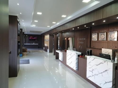 a lobby of a store with marble counter tops at Hotel Joaçaba in Joaçaba