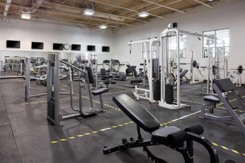 a gym with a lot of tread machines at Best Western Parkway Hotel Toronto North in Richmond Hill