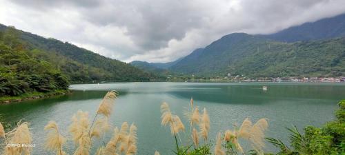 a view of a lake with mountains in the background at Lakeside 46 in Chinan