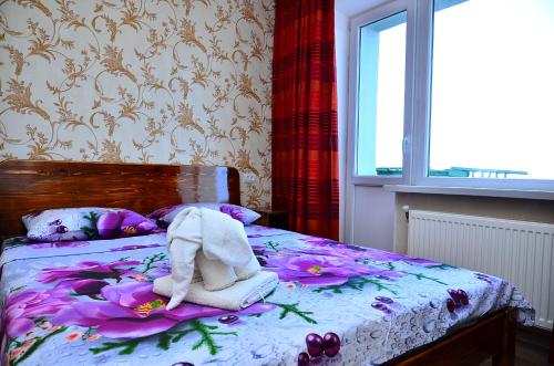 a bedroom with a bed with a towel on it at Героїв Танкістів, 8 in Fastov