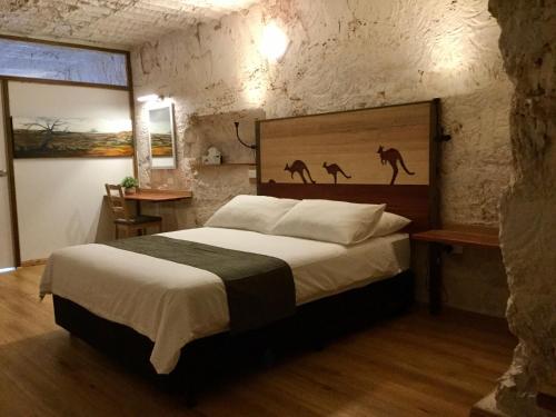 Postel nebo postele na pokoji v ubytování Dug Out B&B