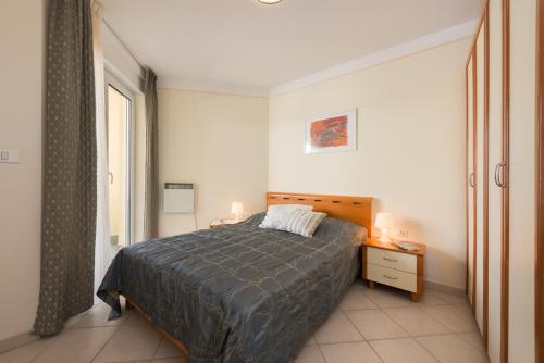Krevet ili kreveti u jedinici u okviru objekta Skiper Apartments & Golf Resort