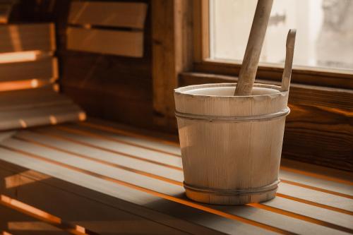 a wooden cup with a spoon in it on a table at Samnaunerhof Vital-Hotel in Samnaun