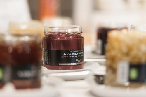 a jar of jam sitting on top of a table at Samnaunerhof Vital-Hotel in Samnaun