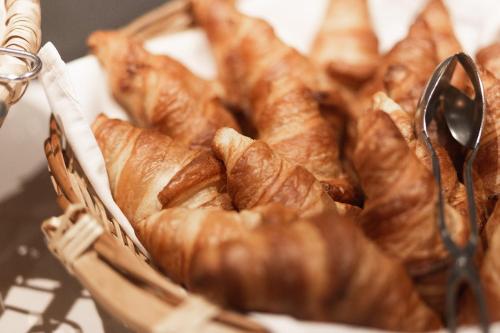 a basket filled with croissants on top of a table at Samnaunerhof Vital-Hotel in Samnaun
