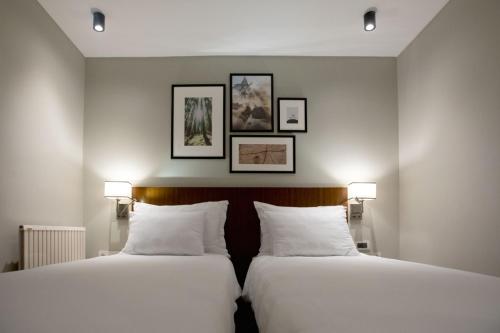 Ένα ή περισσότερα κρεβάτια σε δωμάτιο στο Suadhan Hotel