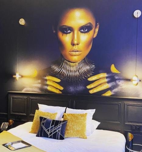 Ein Bett oder Betten in einem Zimmer der Unterkunft Leprince Hotel Spa; Best Western Premier Collection