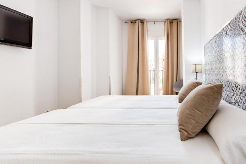 Letto o letti in una camera di Hotel Madrid