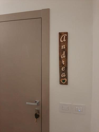 a door with a sign on the side of it at B and B nonna Rosa vista Lagorai in Capriana