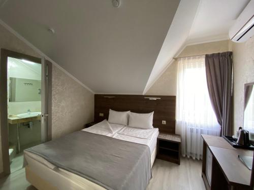 Кровать или кровати в номере Отель Маро