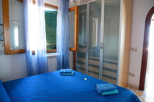 Postel nebo postele na pokoji v ubytování Profumo di mare