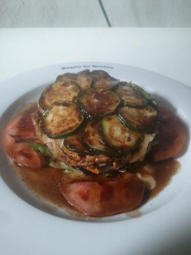 a plate of food on a white plate at Hostal-Restaurante Fogón de Gredos in Guisando