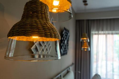 a chandelier hanging from the ceiling in a room at Agata Hotel Boutique & Spa in Mexico City