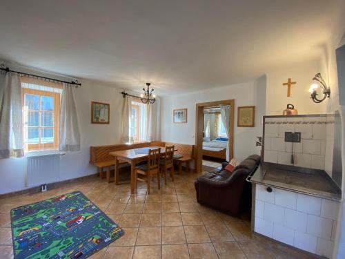 a living room with a kitchen and a dining room at Kürbishof Gartner in Fehring