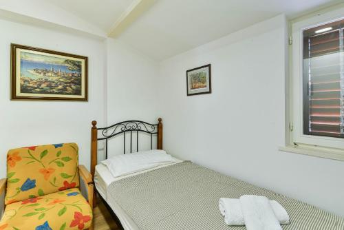 Säng eller sängar i ett rum på Privlaka Holiday House