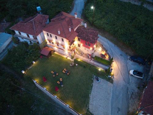 an overhead view of a house with a yard with lights at Archontiko Mesohori Meteora in Kalabaka
