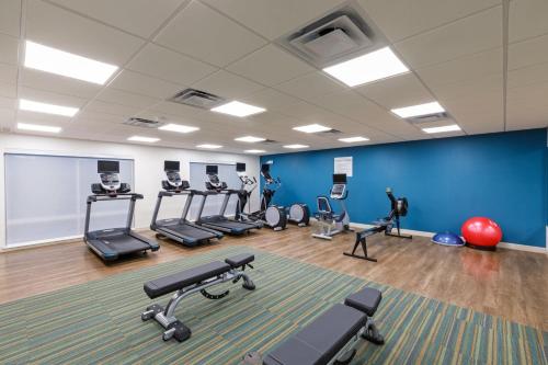 a gym with treadmills and exercise equipment in a room at Holiday Inn Express & Suites Purcell by IHG in Purcell