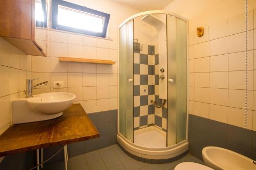 a bathroom with a sink and a shower at Casale Bavi in Ortona