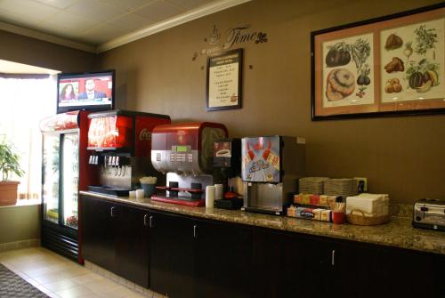 a counter in a fast food restaurant with machines at Anaheim Majestic Garden Hotel in Anaheim