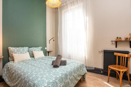 Katil atau katil-katil dalam bilik di Appartements Scaliger Jardin Wifi Proche Gare