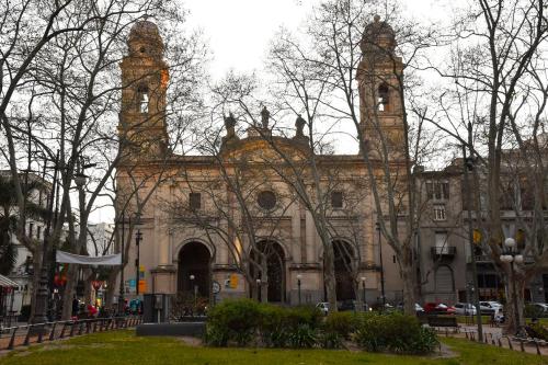 an old building with two towers on top of it at Hotel Palacio in Montevideo