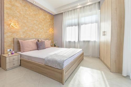 a bedroom with a large bed and a window at 4. Sea view luxury suite for 4 in Rhodes centre! in Rhodes Town