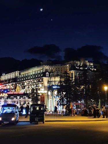 a city street with a building at night at Sapa Centre Hotel in Sa Pa