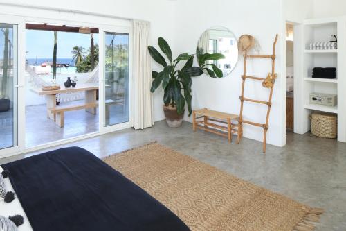 a bedroom with a bed and a view of the ocean at El 55 Sayulita Stylish couple getaway rooftop pool in Sayulita