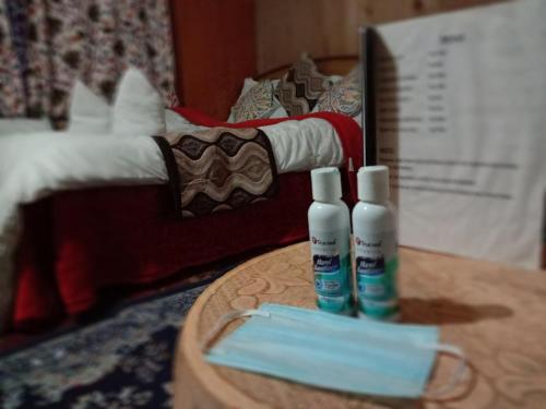two bottles ofodorizers are sitting on a table at S Group Of Houseboat in Srinagar