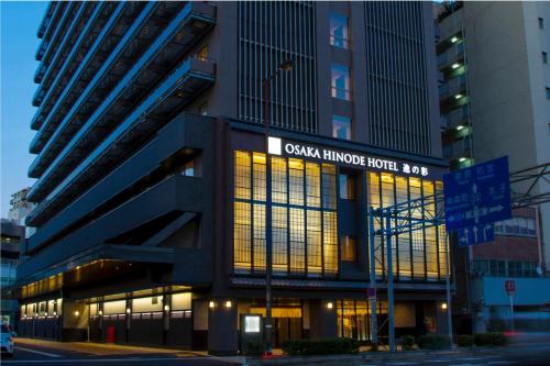 a building with a sign that reads casa hirsch hotel bay at Hot Spring Osaka Hinode Hotel Nipponbashi in Osaka